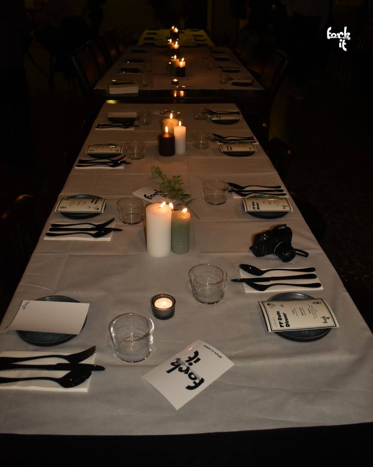 A long candlelit Fork It dinner table set for the evening