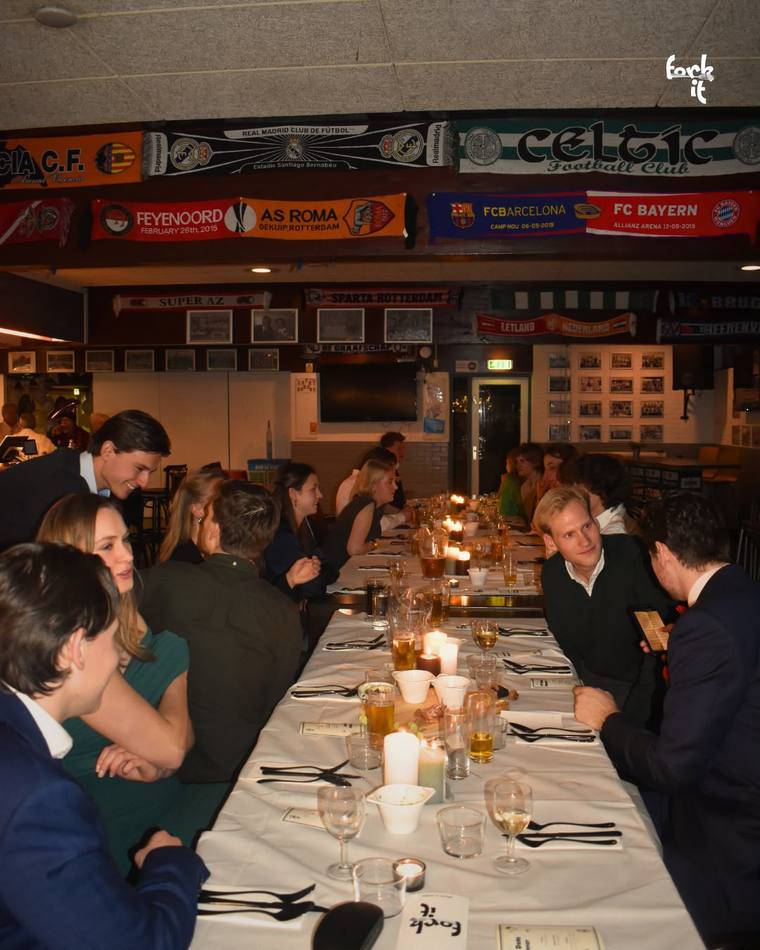 Guests seated at a long private dinner table